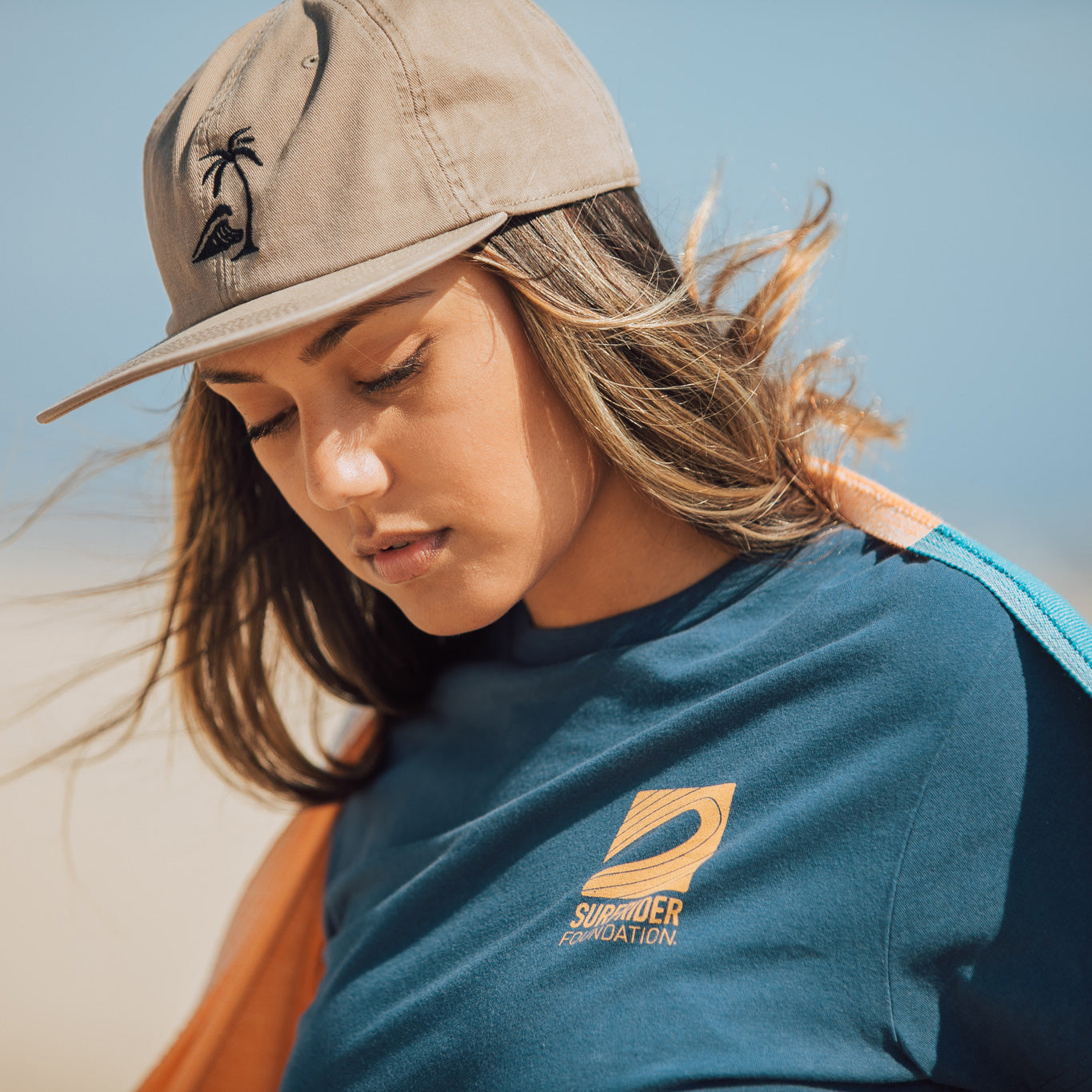 Close up of Surfrider Foundation logo on tee. 